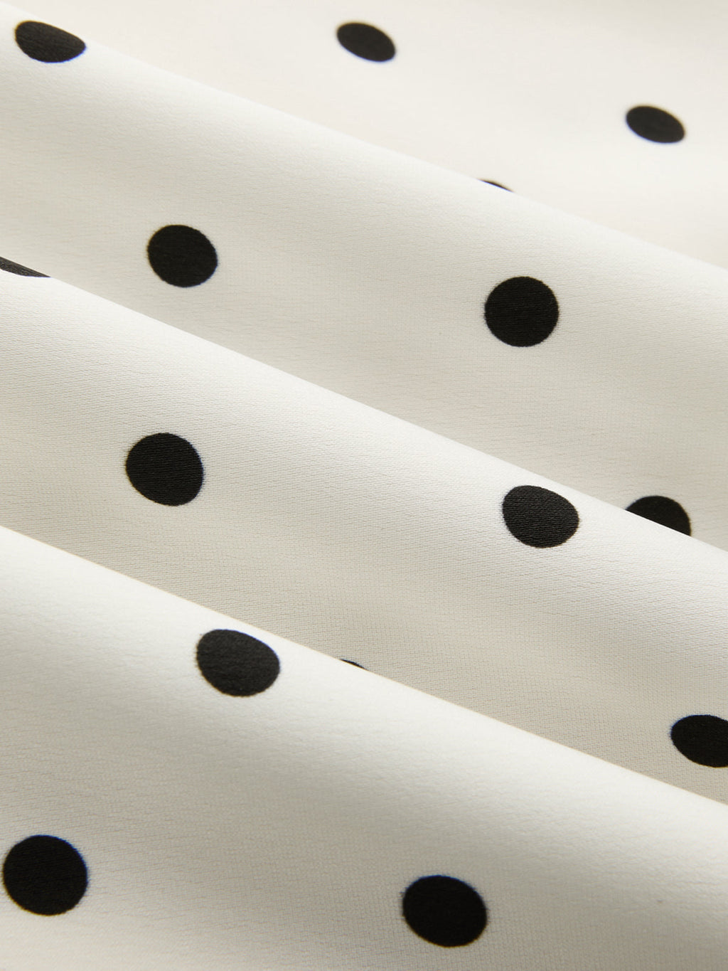 Jupe midi asymétrique en dentelle à pois