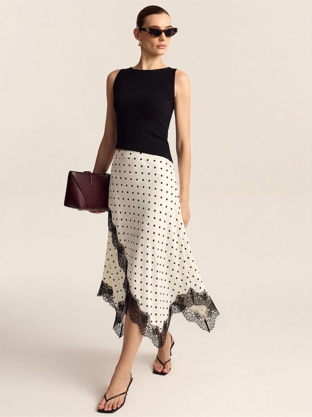 Jupe midi asymétrique en dentelle à pois